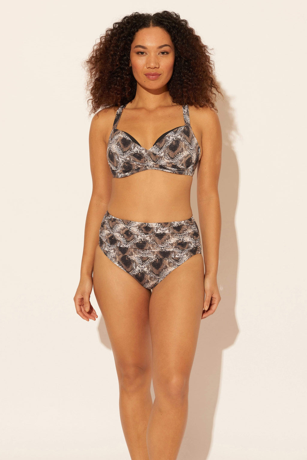 Zoe is wearing a 8 suit, she has a 34D bust and a 29” waist.