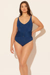 Sara is wearing a 10 suit, she has a 36D bust and a 30.5” waist.