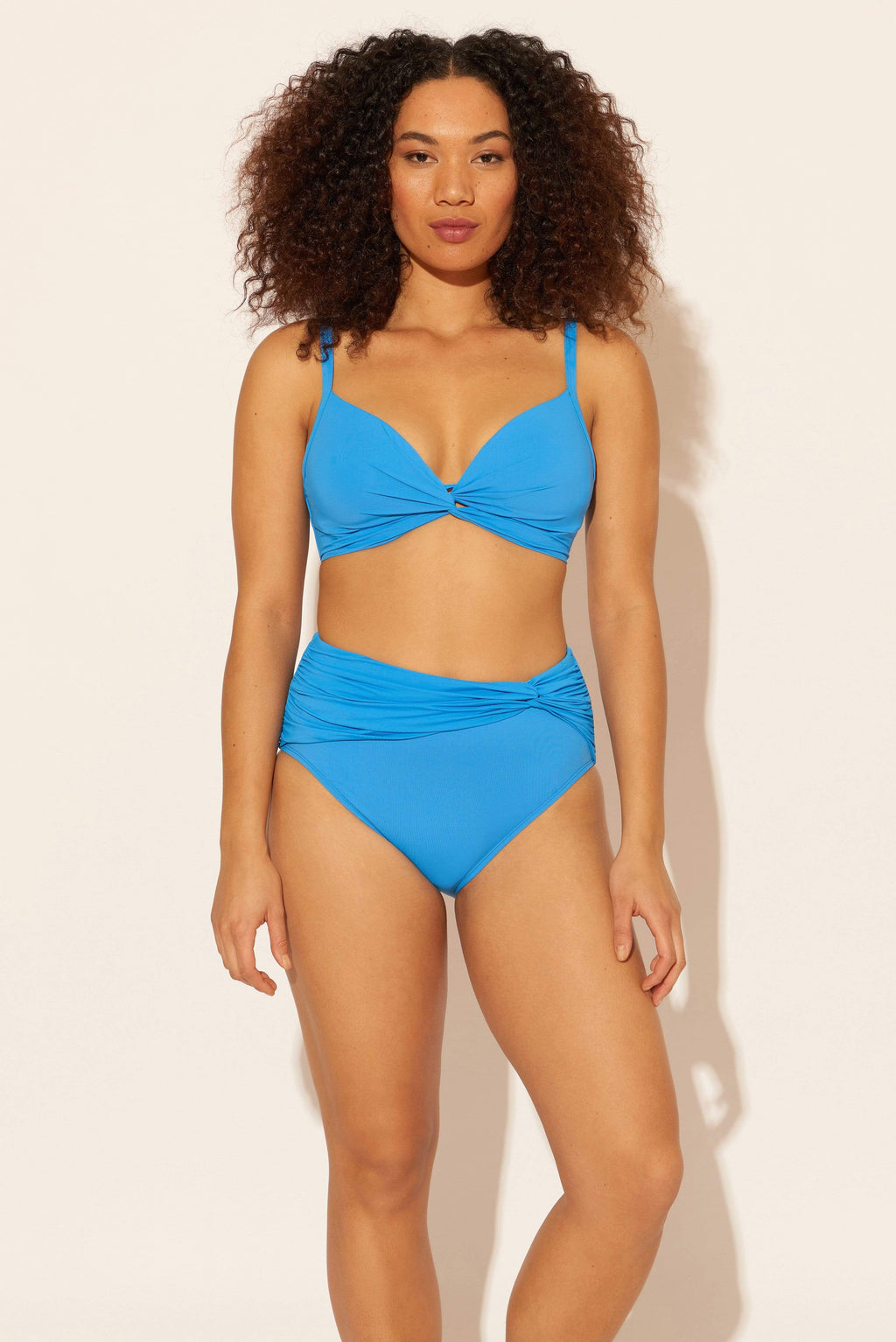 Zoe is wearing a 8 suit, she has a 34D bust and a 29” waist.