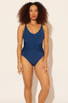 Zoe is wearing a 8 suit, she has a 34D bust and a 29” waist.