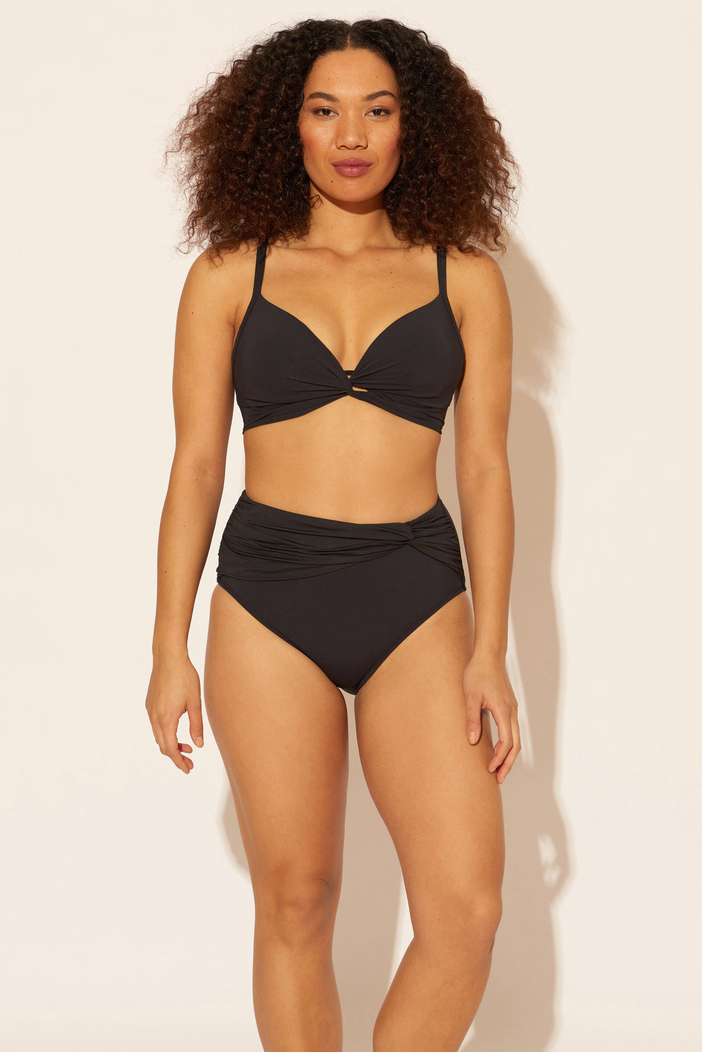 Zoe is wearing a 8 suit, she has a 34D bust and a 29” waist.