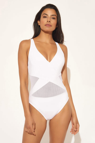 Gio is wearing a 6 suit, she has a 34” bust and a 24” waist.
