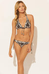 Lada is wearing a 6 suit, she has a 34” bust and a 24" waist.