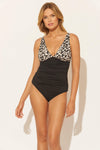 Lada is wearing a 6 suit, she has a 34” bust and a 24" waist