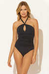 Lada is wearing a 6 suit, she has a 34” bust and a 24" waist.