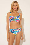 Lada is wearing a 6 suit, she has a 34” bust and a 24" waist.
