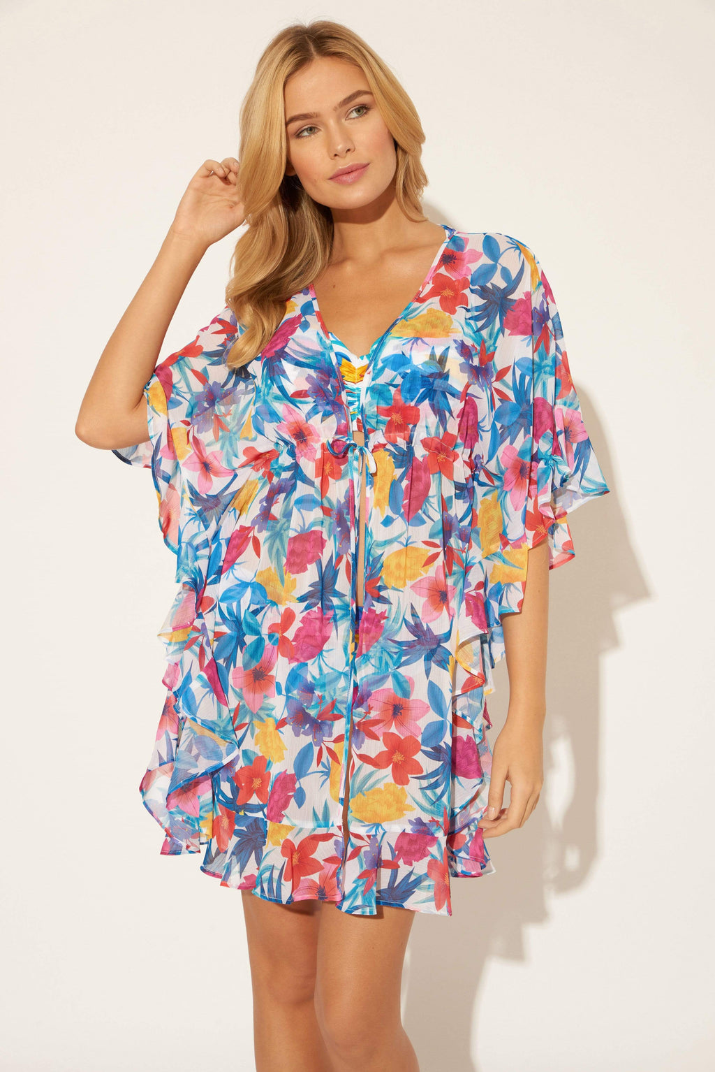 Lada is wearing a 6 suit and S coverup, she has a 34” bust and a 24