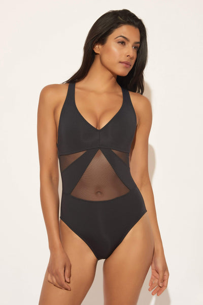 Gio is wearing a 6 suit, she has a 34” bust and a 24” waist.