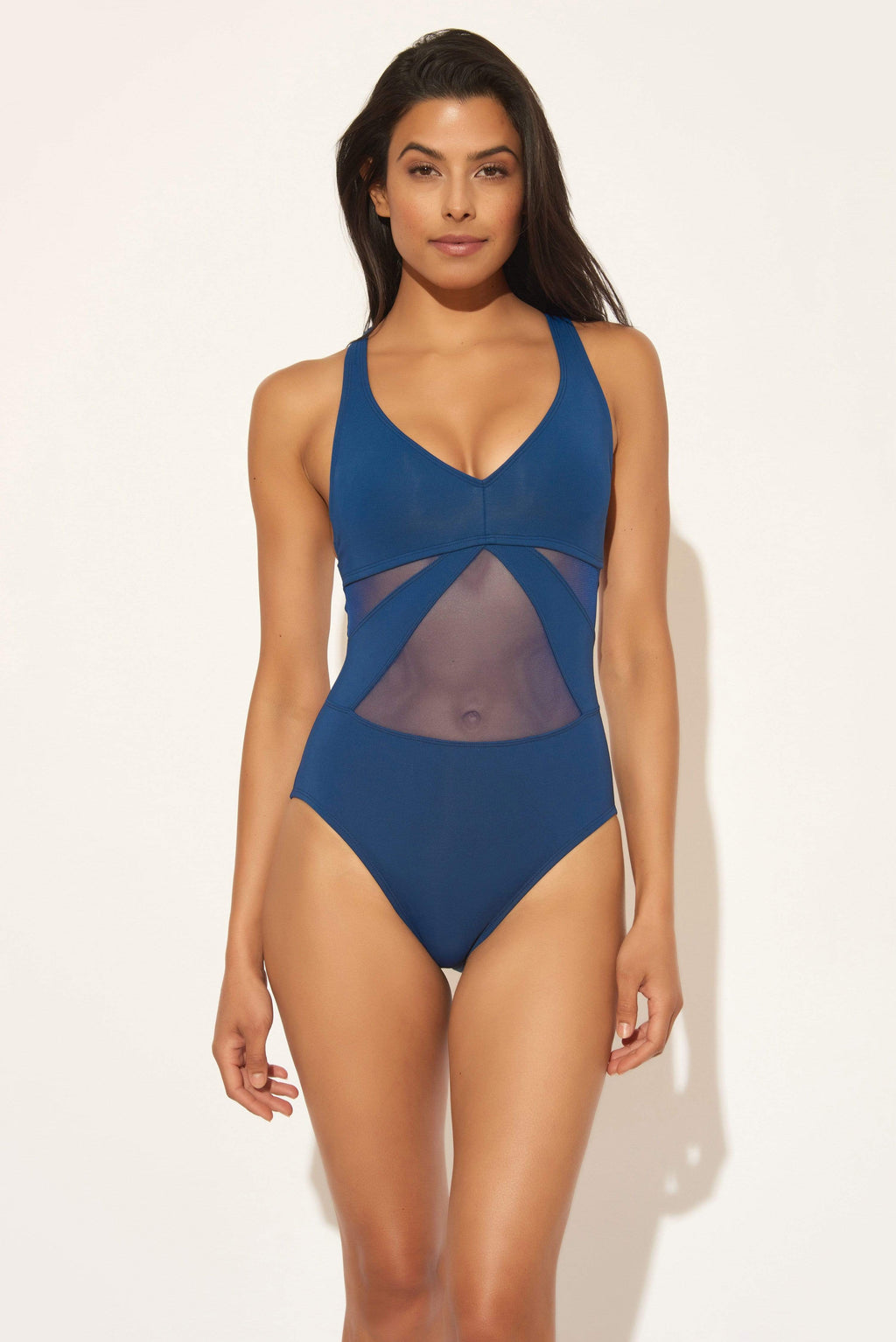 Gio is wearing a 6 suit, she has a 34” bust and a 24” waist.